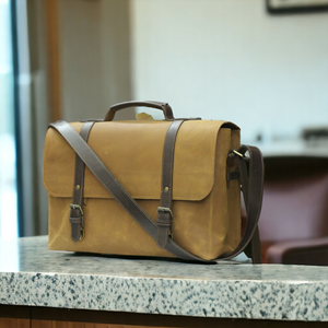 This multi-functional leather bag is perfect for the modern man on the go. With its sturdy construction, it can hold a laptop, books, and essentials for work or school. The cross-body design keeps hands free while the leather adds a touch of sophistication. Stay organized and stylish with this versatile briefcase.
