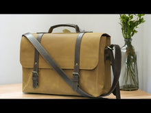Load and play video in Gallery viewer, This multi-functional leather bag is perfect for the modern man on the go. With its sturdy construction, it can hold a laptop, books, and essentials for work or school. The cross-body design keeps hands free while the leather adds a touch of sophistication. Stay organized and stylish with this versatile briefcase.
